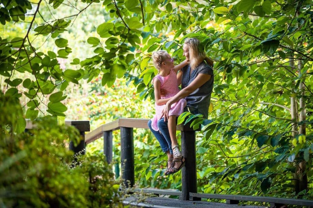 Mum and daughter under a tree