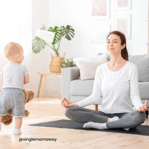 Mother meditating with toddler watching