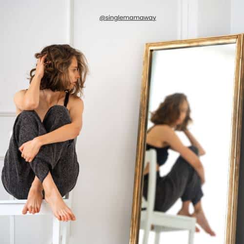 Woman reflecting in a mirrow single mama way