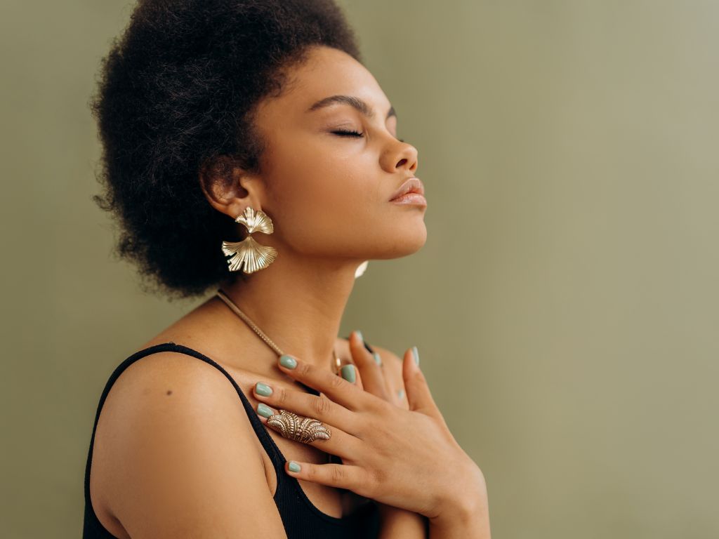 Mother taking a deep breath to manage the mental load and bring balance